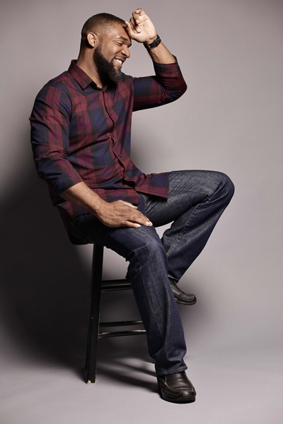 Jay Cameron laughing in a plaid shirt